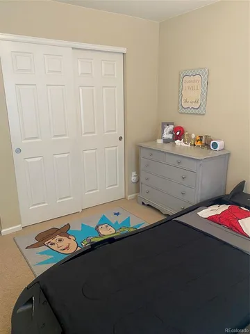 a bed room with a bed and a window