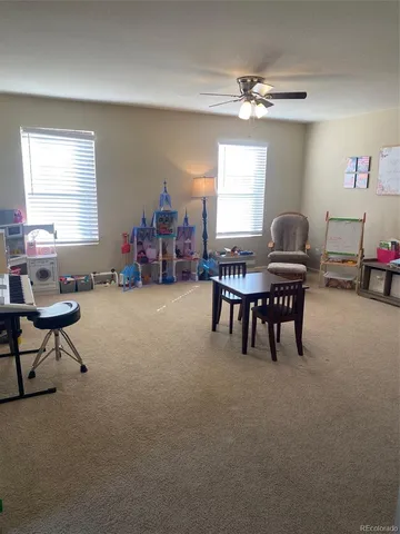 a livingroom with furniture and a large window