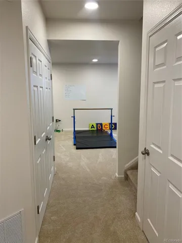 a room with pool and a rug