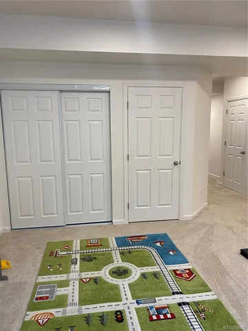 a bedroom with a bed and a table in it