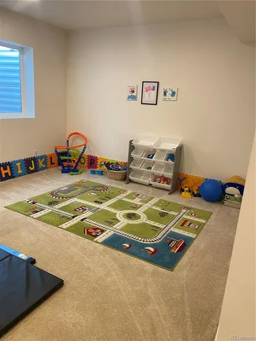 a living room with furniture and a rug