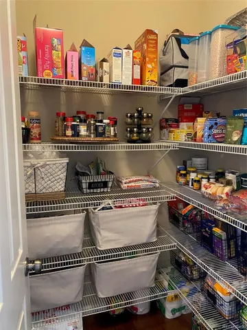 a kitchen with a stove and a shelf