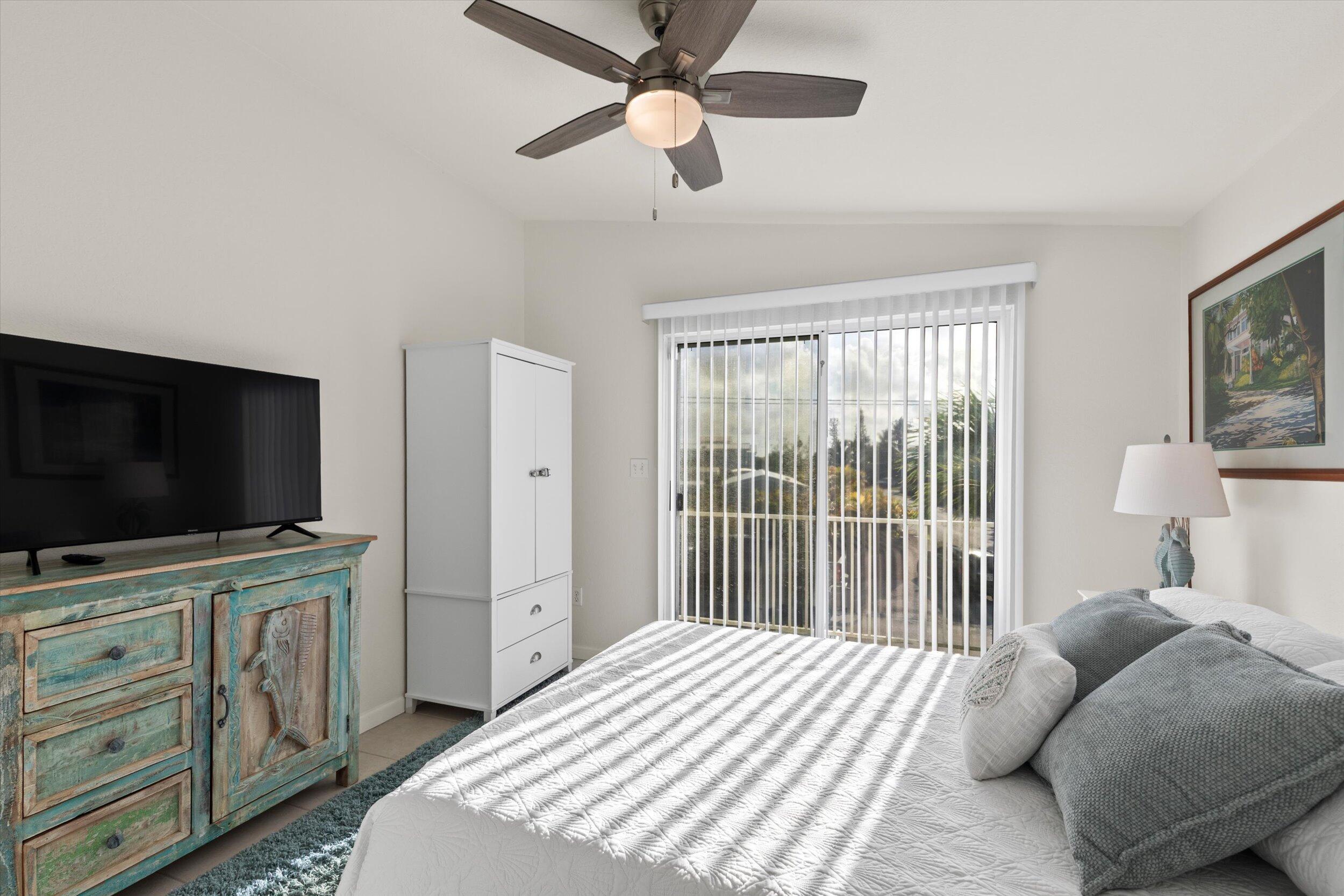 157 Mars Lane Key West, FL 33040 - Photo 21 of 41 a bedroom with a bed and a flat screen tv