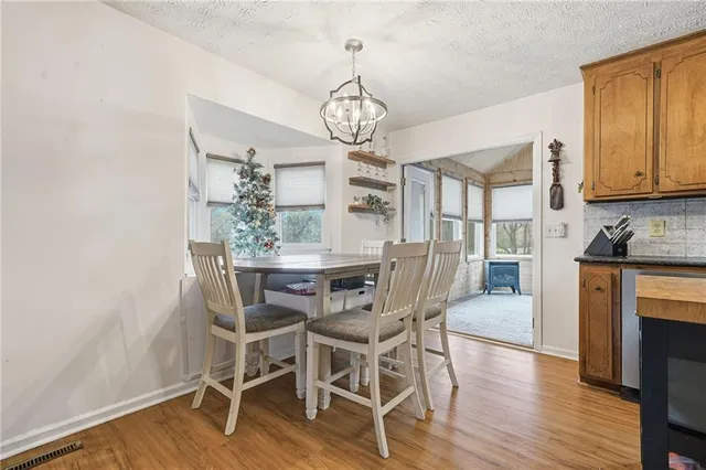 a spacious bathroom with a large tub and large windows