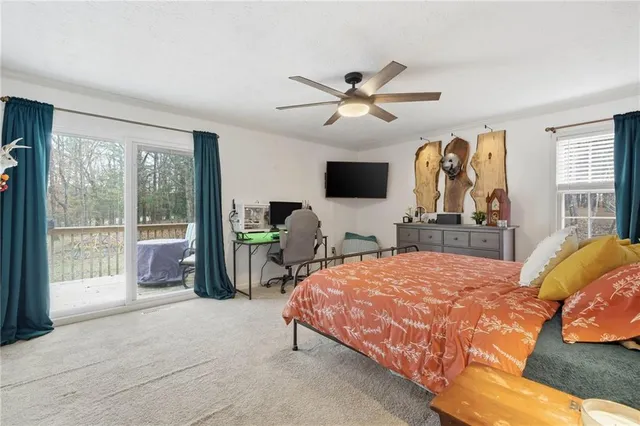 a bedroom with a workspace