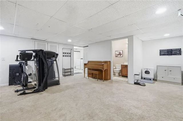 a bedroom with furniture and a flat screen tv