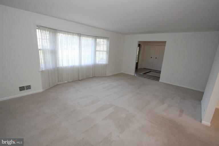 15101 Middlegate Road Silver Spring, MD 20905 - Photo 26 of 28 large living room with bay window