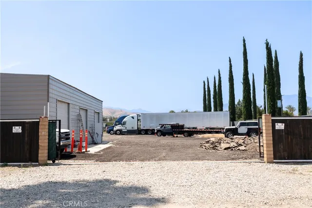 a view of a street with cars