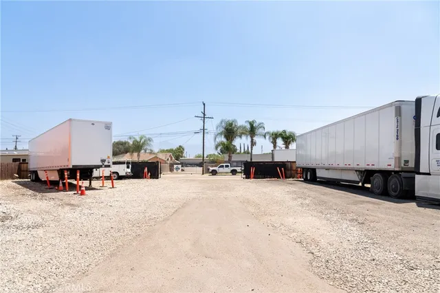 a front view of a house with a garden and plants