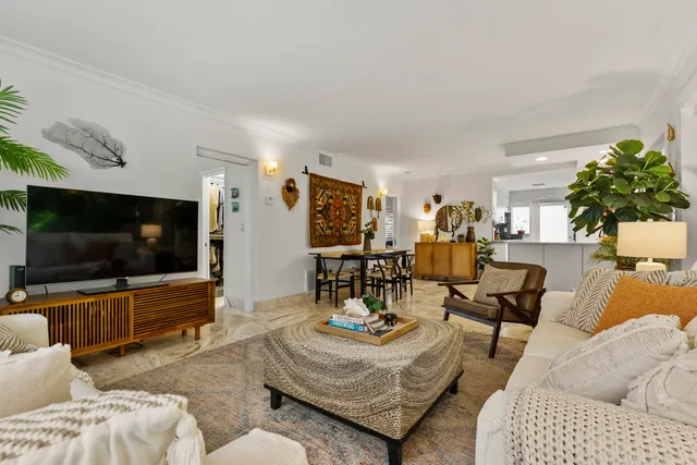 a bedroom with a bed and windows