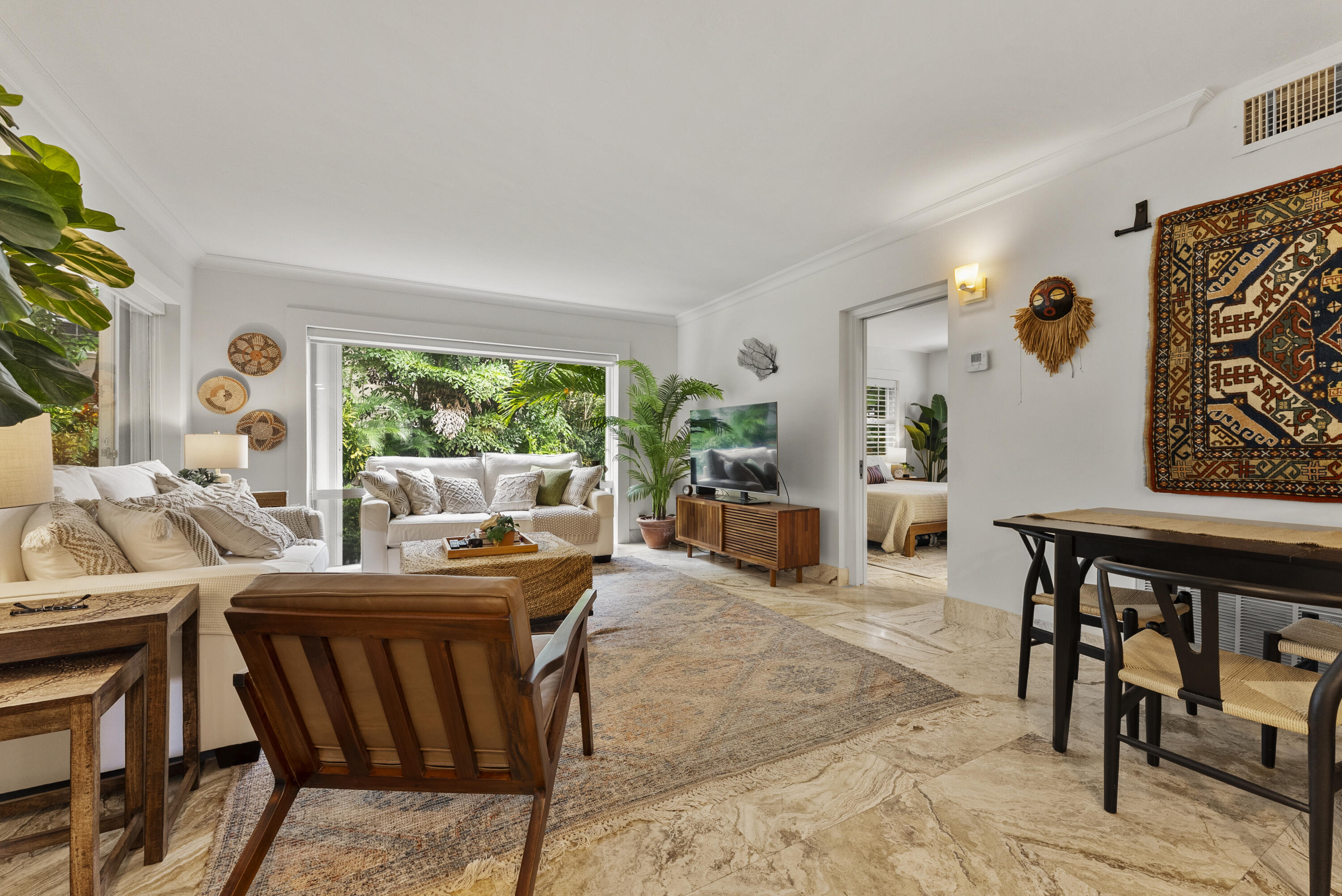 1202 Hillsboro Mile, Unit 2A Hillsboro Beach, FL 33062 - Photo 15 of 54 a dining room with furniture and a large window