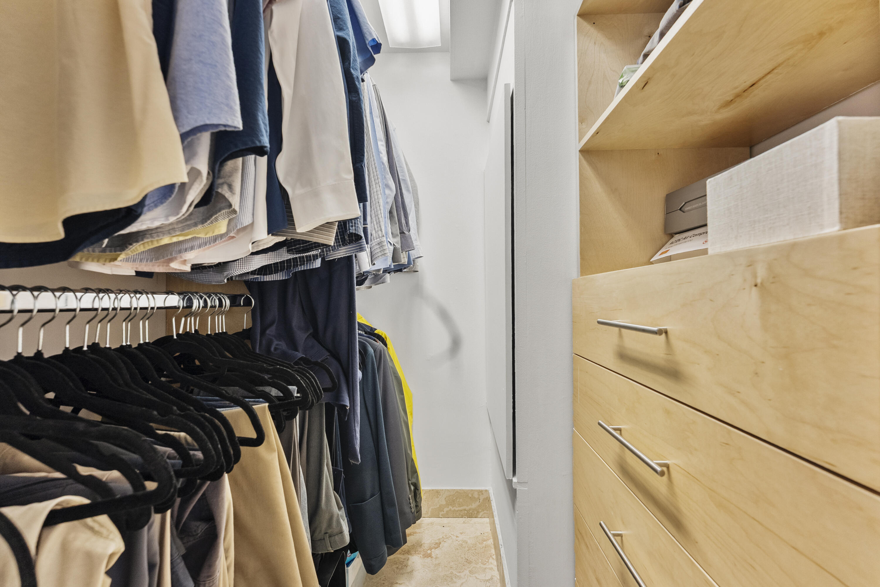 1202 Hillsboro Mile, Unit 2A Hillsboro Beach, FL 33062 - Photo 18 of 54 a view of walk in closet with clothes and shoes