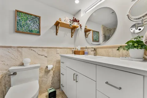 a view of a chair and table in backyard of the house