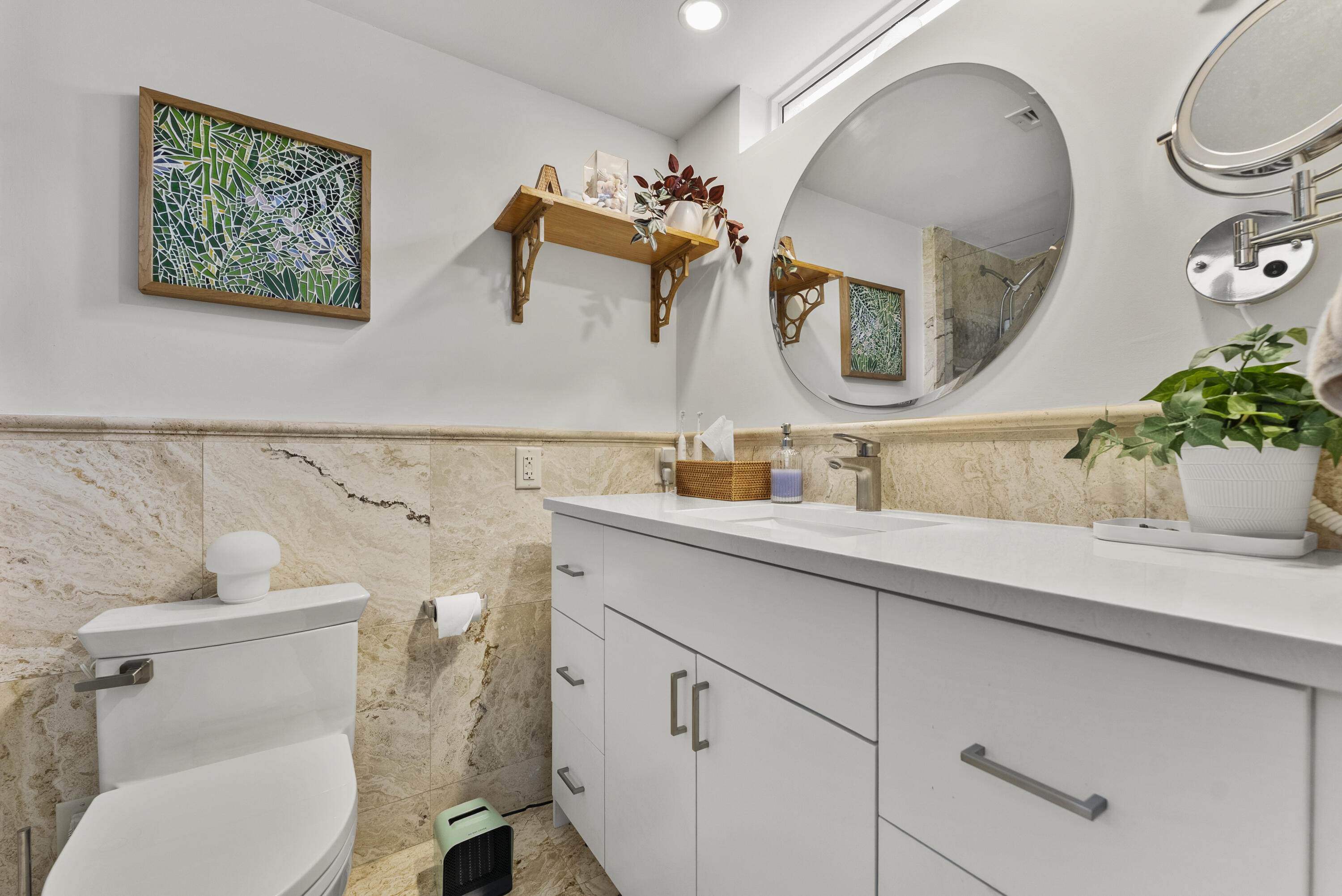 1202 Hillsboro Mile, Unit 2A Hillsboro Beach, FL 33062 - Photo 23 of 54 a bathroom with a toilet sink and mirror