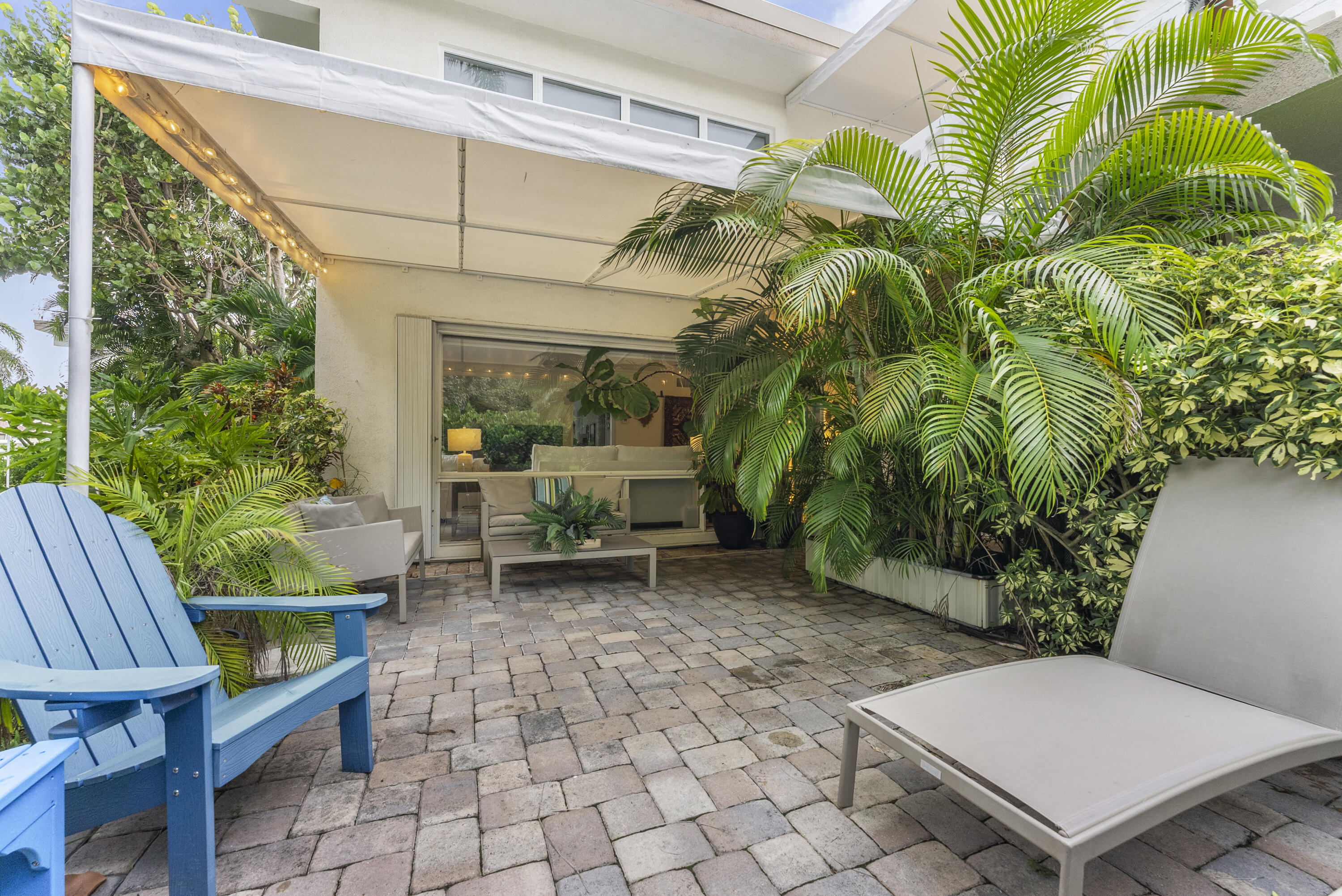 1202 Hillsboro Mile, Unit 2A Hillsboro Beach, FL 33062 - Photo 29 of 54 a view of a chair and table in backyard of the house