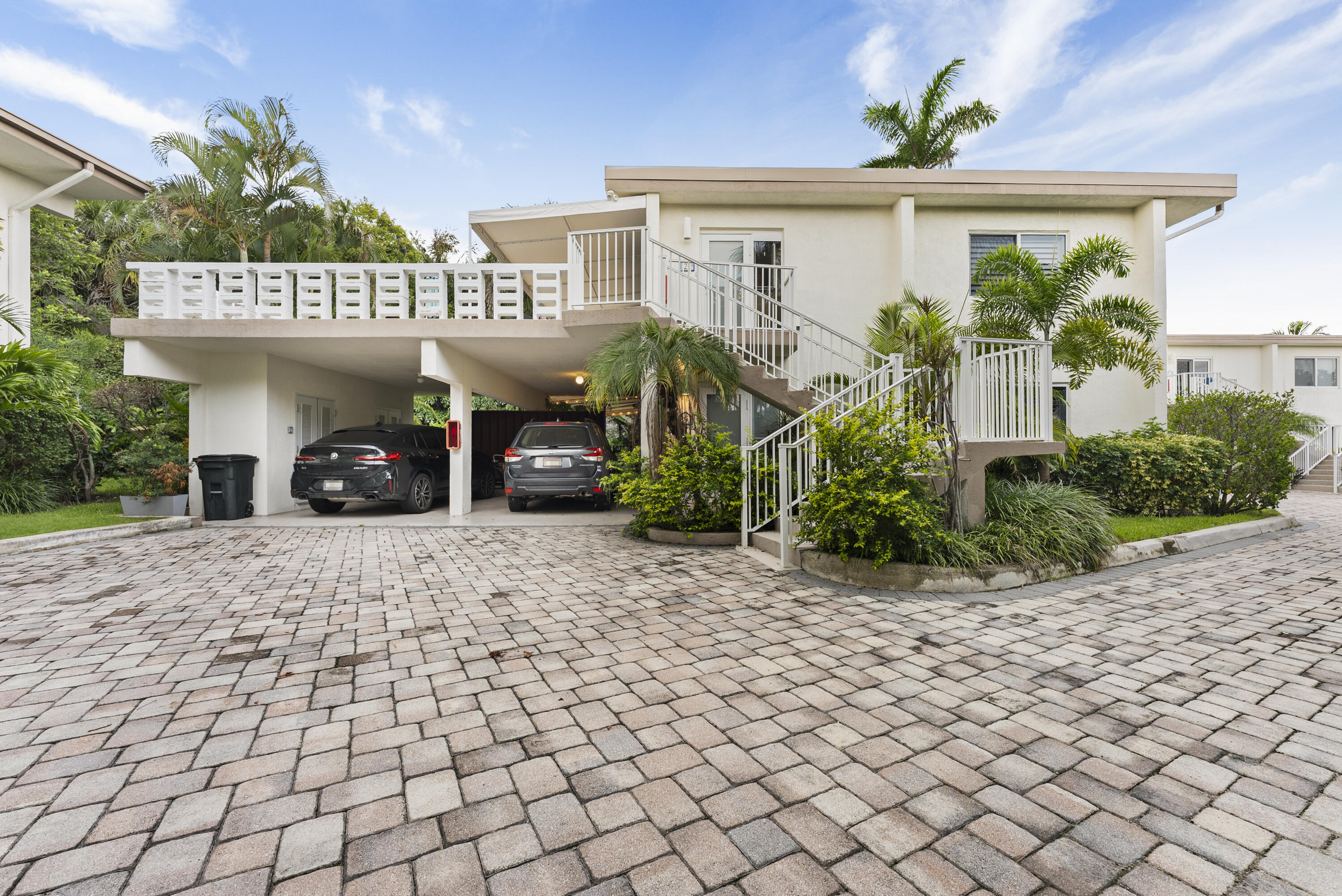 1202 Hillsboro Mile, Unit 2A Hillsboro Beach, FL 33062 - Photo 36 of 54 a front view of a house with a yard