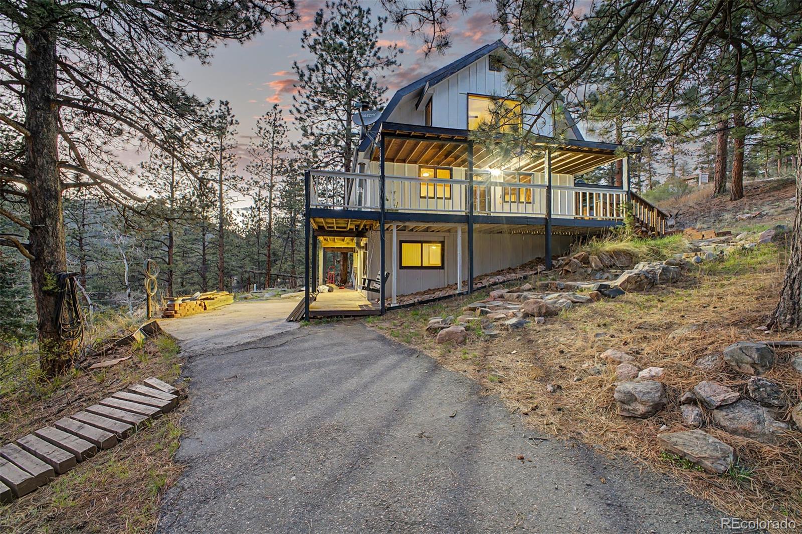 145 Bailey Drive Bailey, CO 80421 - Photo 29 of 31 a view of a house with large trees
