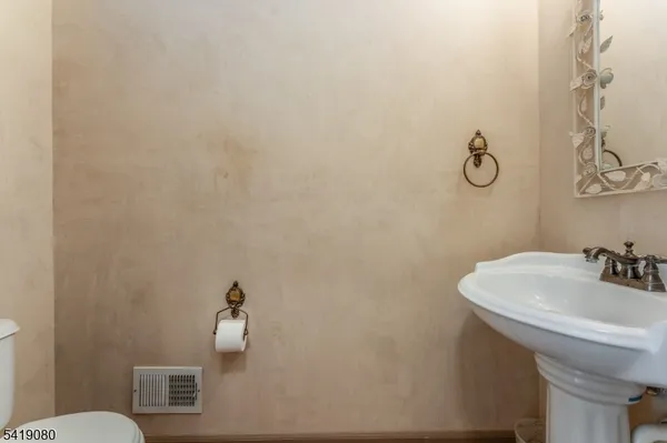 a bathroom with a sink and mirror
