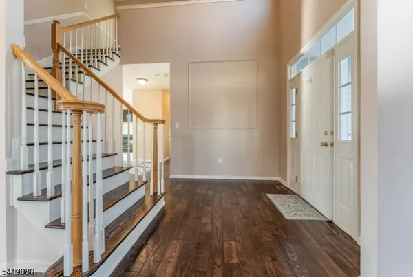 a view of entryway with wooden floor