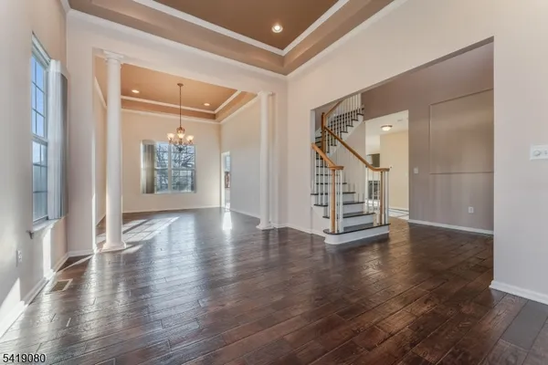 a view of an entryway with wooden floor