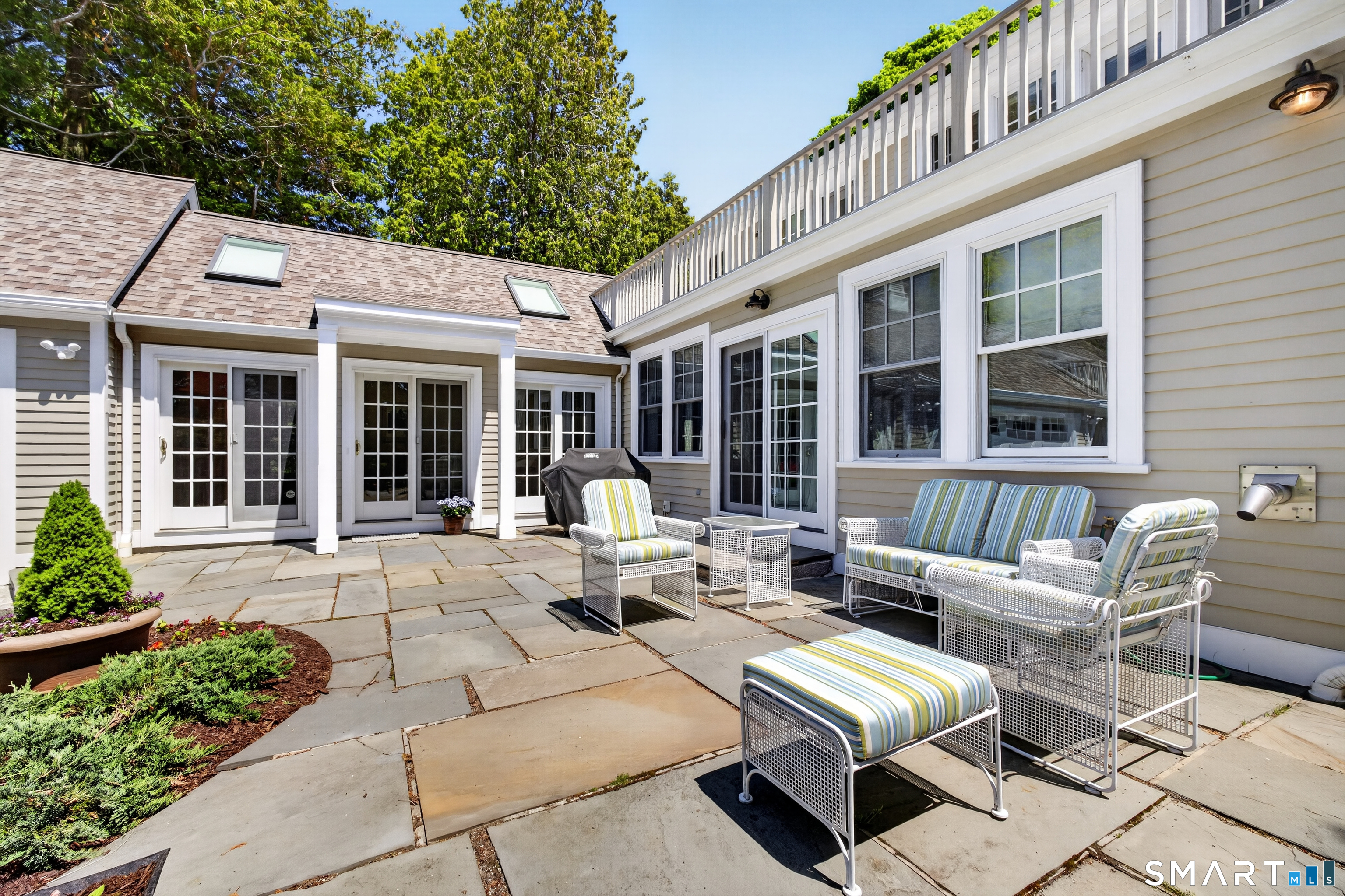 10 Prospect Street Groton, CT 06355 - Photo 14 of 40 a view of a patio with couches table and chairs and potted plants