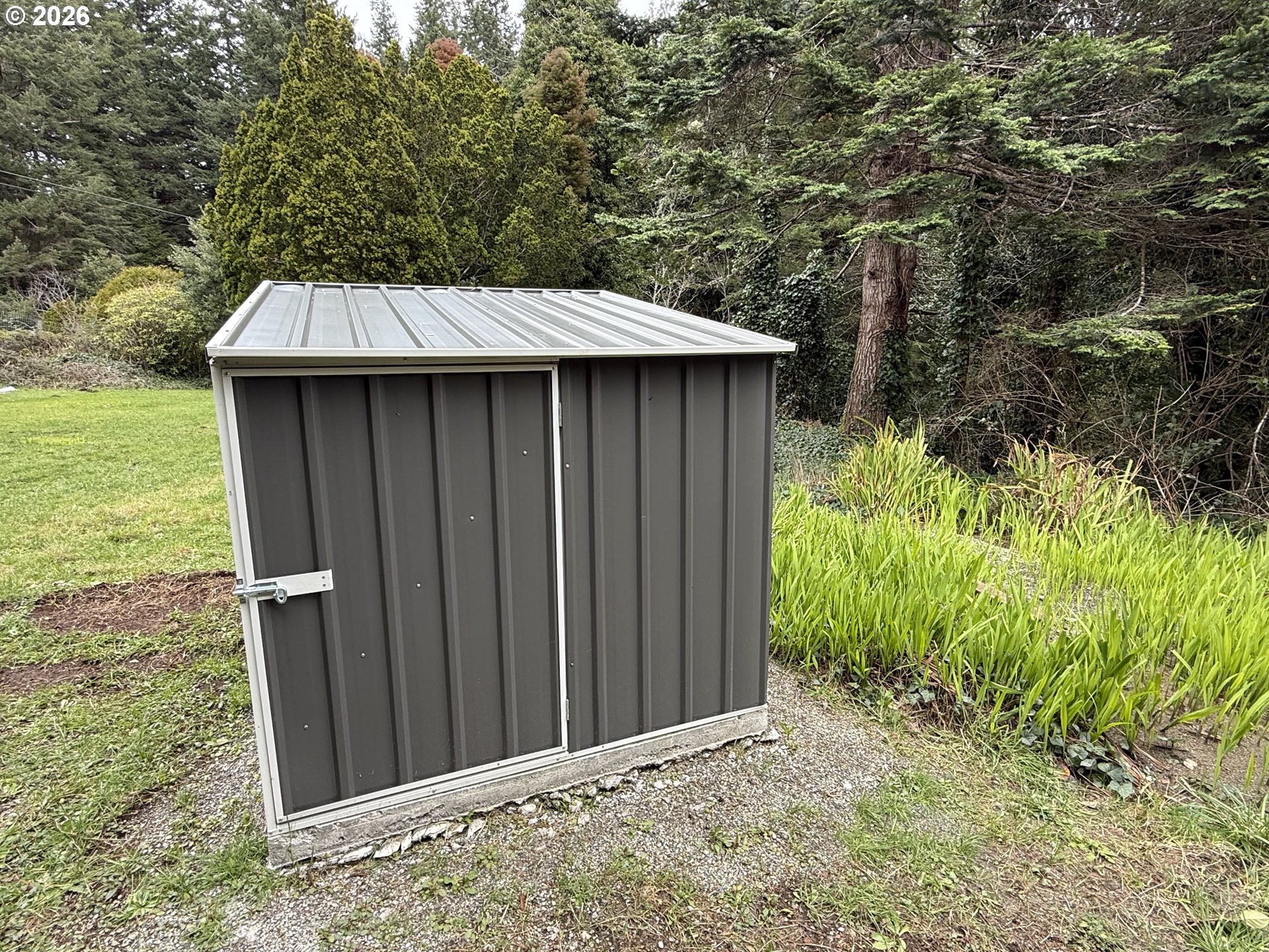 42710 Silver Springs Road Port Orford, OR 97465 - Photo 16 of 21 a backyard of a house with lots of green space