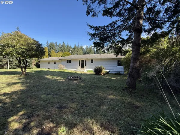 a view of house with outdoor space and sitting area