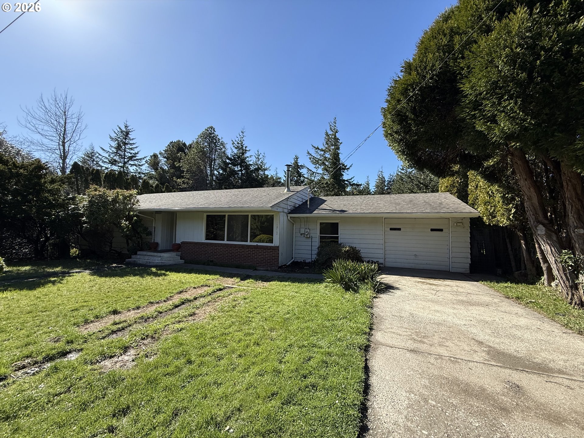 42710 Silver Springs Road Port Orford, OR 97465 - Photo 21 of 21 a view of a house with a yard