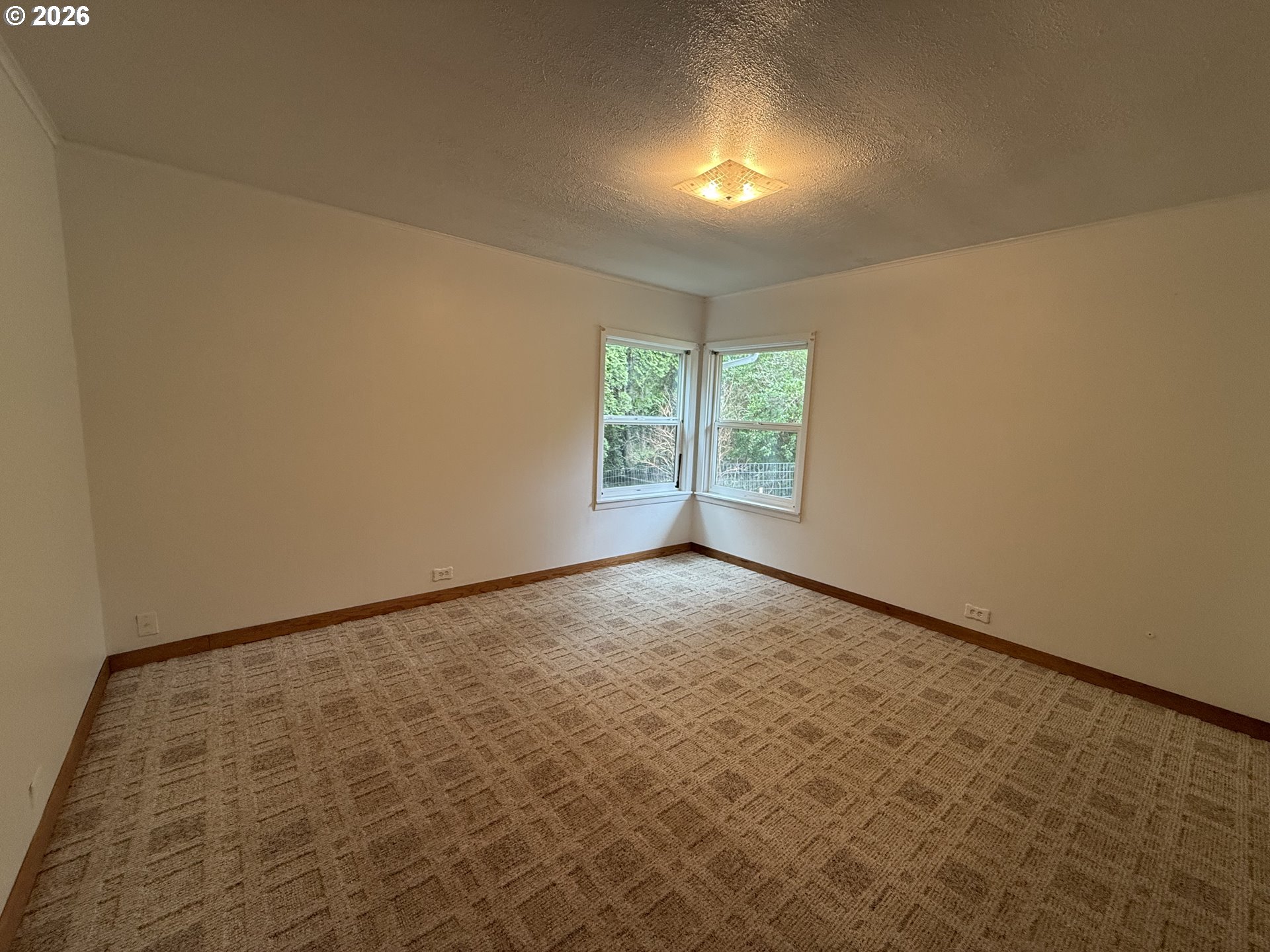 42710 Silver Springs Road Port Orford, OR 97465 - Photo 8 of 21 an empty room with windows