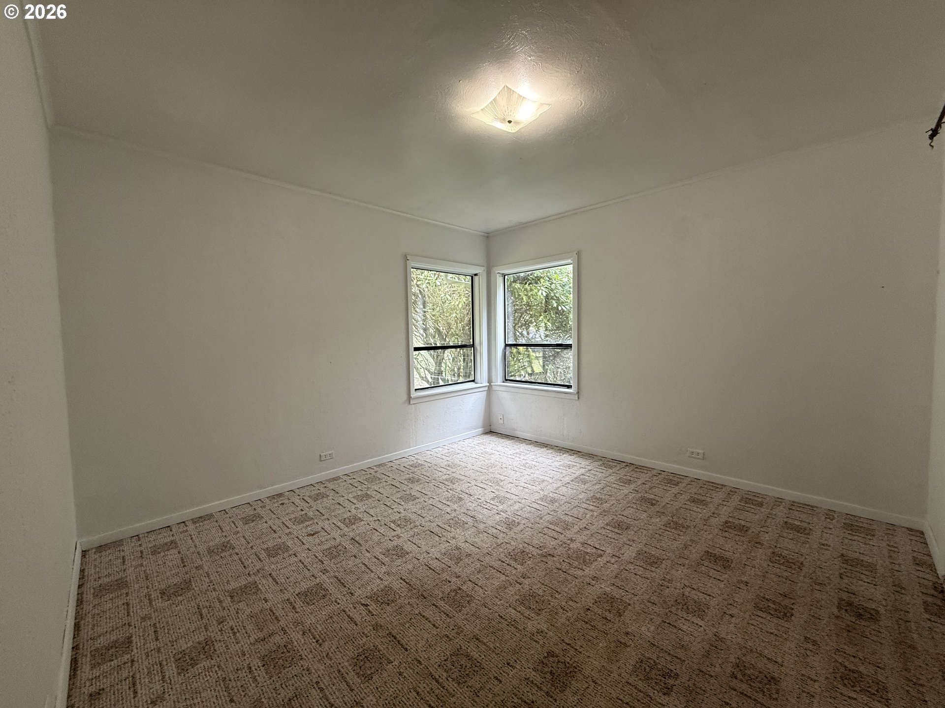 42710 Silver Springs Road Port Orford, OR 97465 - Photo 10 of 21 an empty room with windows