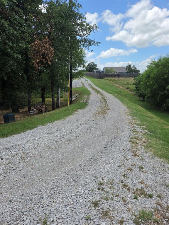 511 Erwin Road Poolville, TX 76487 - Photo 32 of 36 View of private drive leaving the residence