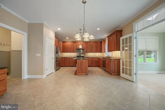 a kitchen with stainless steel appliances granite countertop a stove and a refrigerator