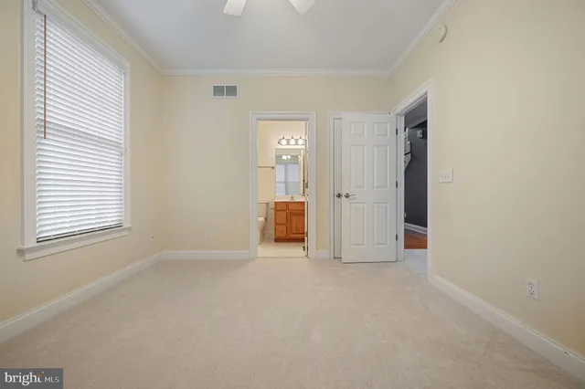 a bathroom with a toilet sink and shower