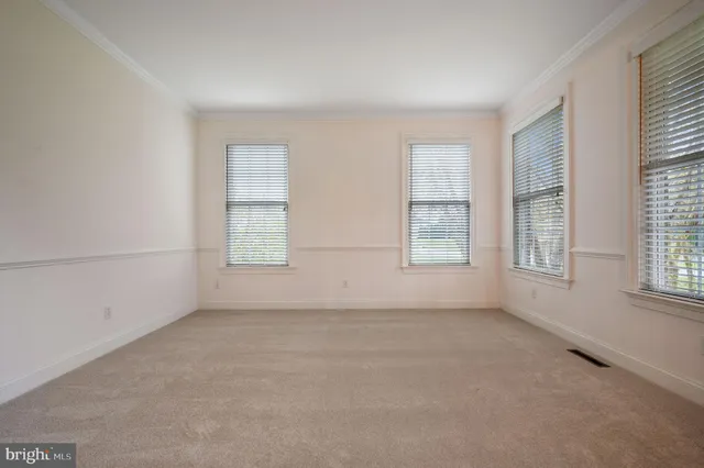 a view of a hallway with windows