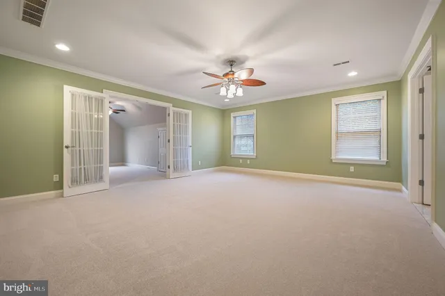 a bathroom with a granite countertop sink a toilet mirror and bathtub