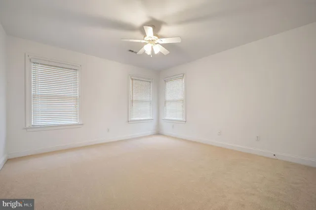 a bathroom with a double vanity sink toilet and shower