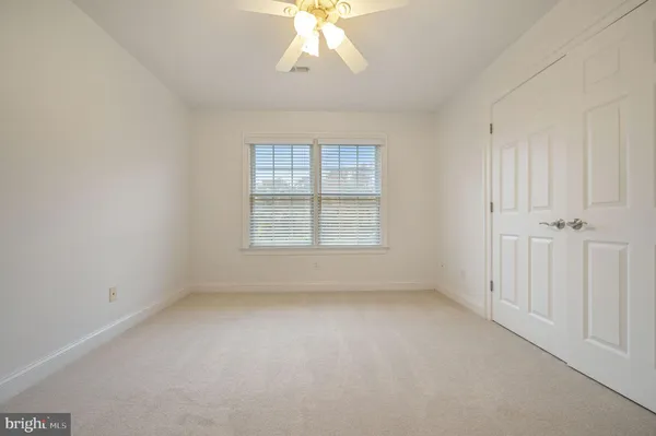 a large room with a bed and a television