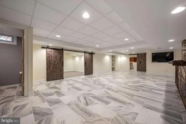 an aerial view of a house with a swimming pool yard and outdoor seating