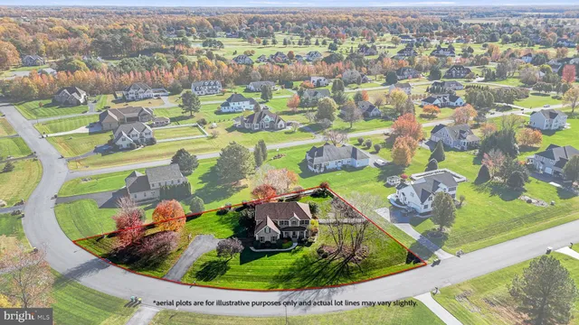 an aerial view of a residential houses with outdoor space