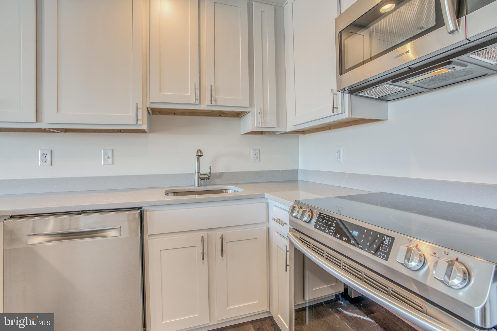 2702 Lighthouse Point East, Unit 626 Baltimore, MD 21224 - Photo 11 of 60 Stainless steel appliances and quartz countertops