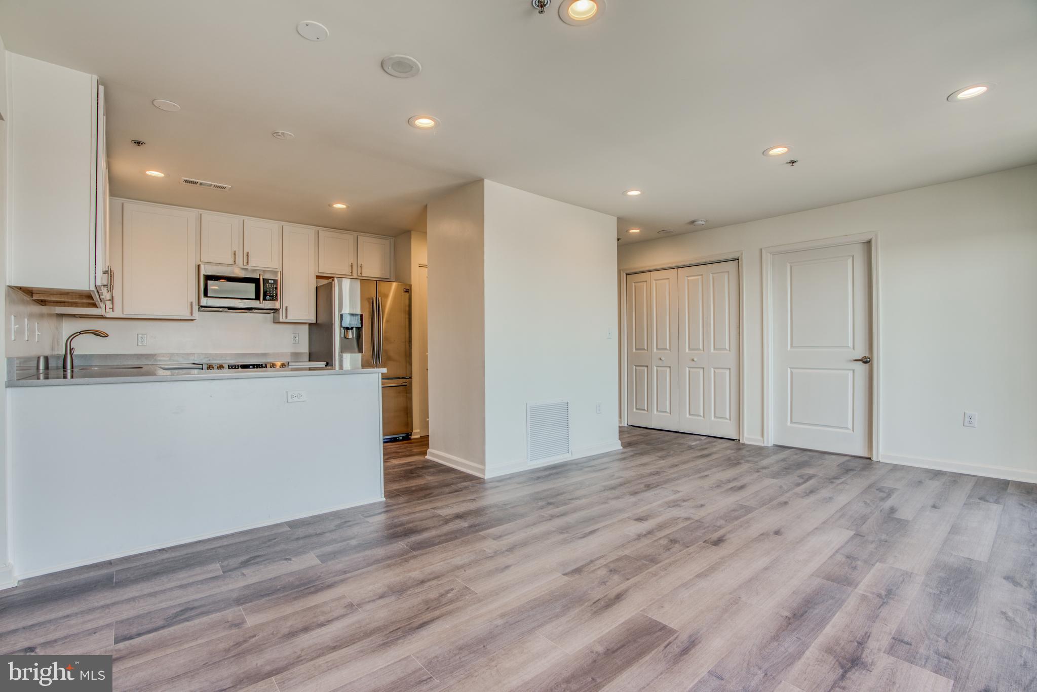 2702 Lighthouse Point East, Unit 626 Baltimore, MD 21224 - Photo 58 of 60 Open floor plan with combo living/dining room