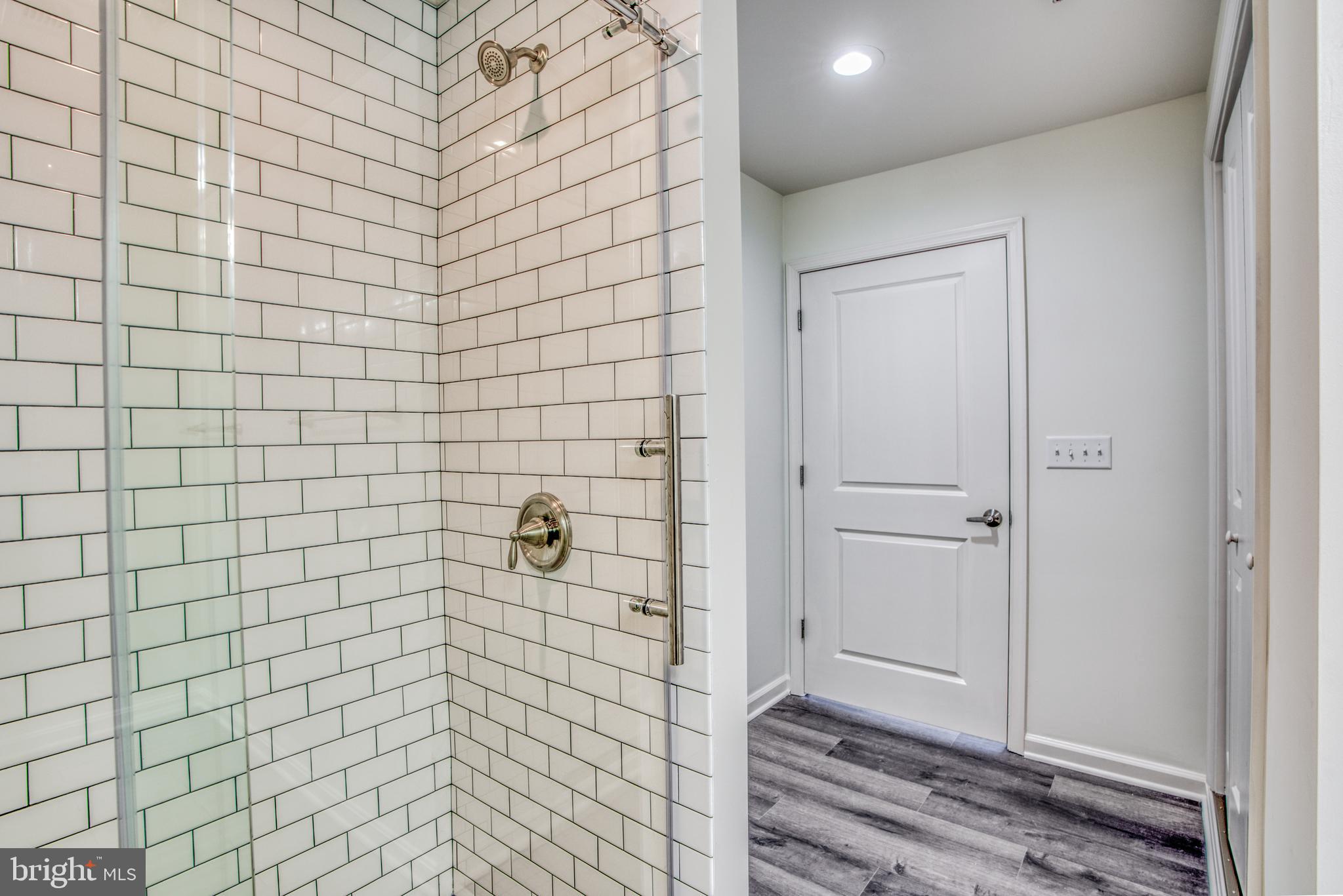 2702 Lighthouse Point East, Unit 626 Baltimore, MD 21224 - Photo 32 of 60 Updated stall shower in primary bathroom