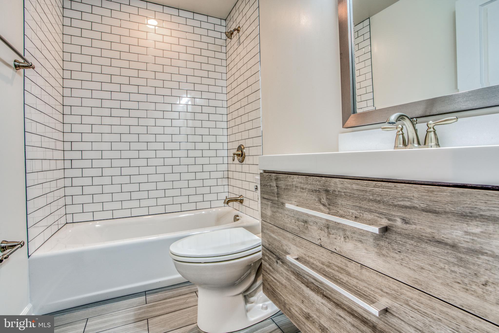 2702 Lighthouse Point East, Unit 626 Baltimore, MD 21224 - Photo 42 of 60 Updated second full bathroom with tub shower