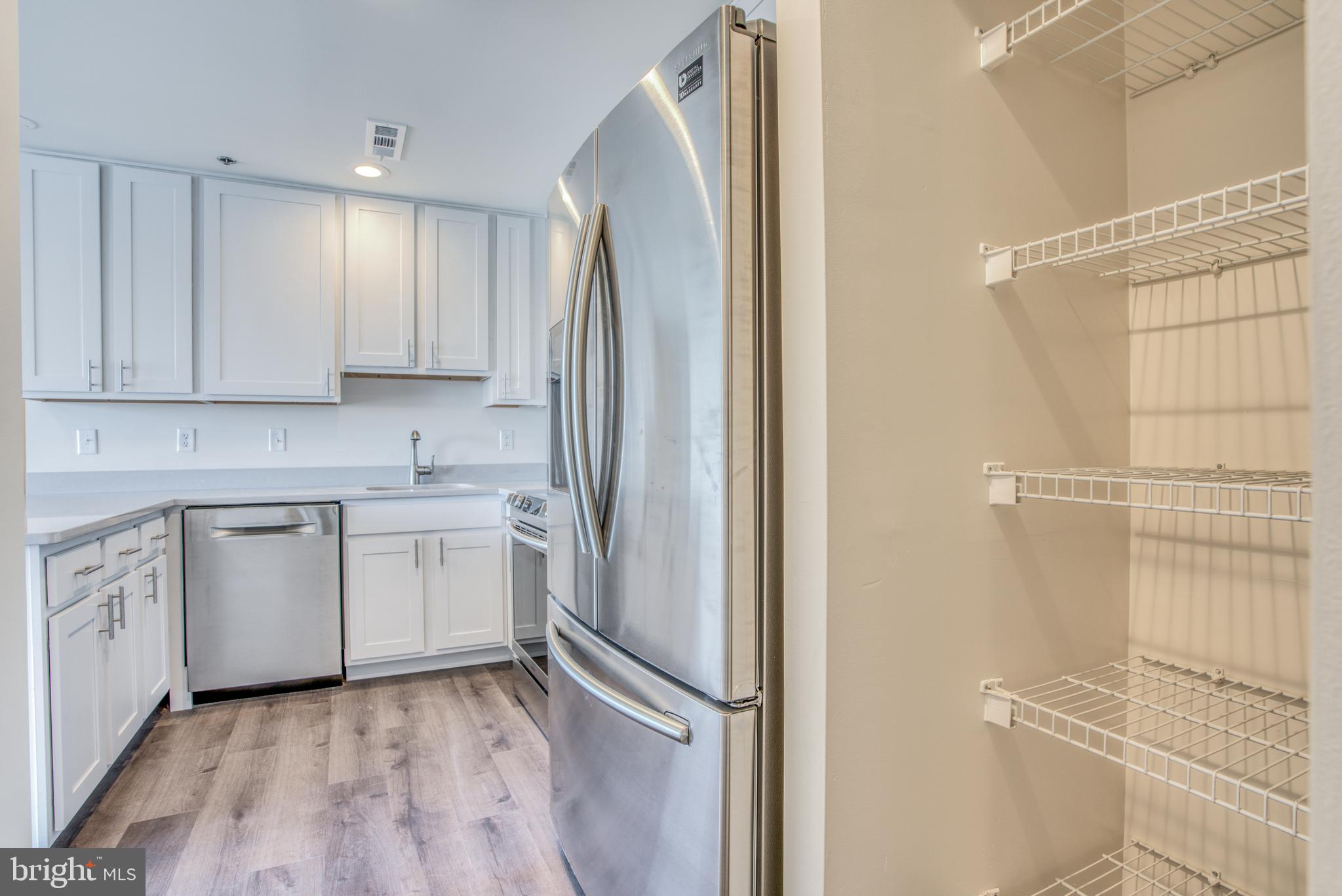 2702 Lighthouse Point East, Unit 626 Baltimore, MD 21224 - Photo 10 of 60 Pantry storage off the kitchen