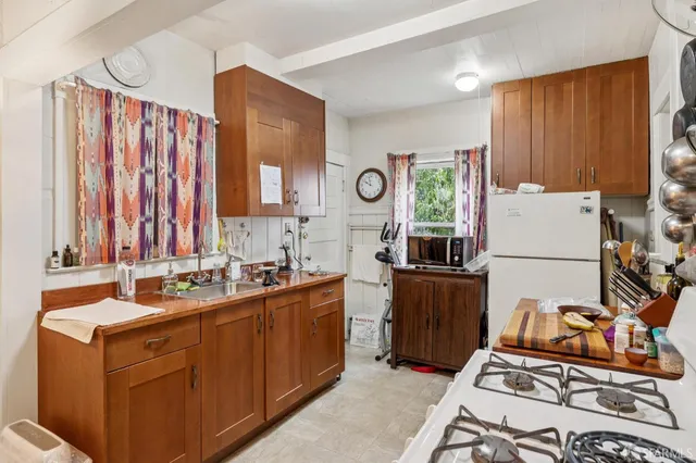 a view of a kitchen with sink dryer and washer