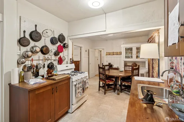 a view of a workspace with furniture and a fireplace