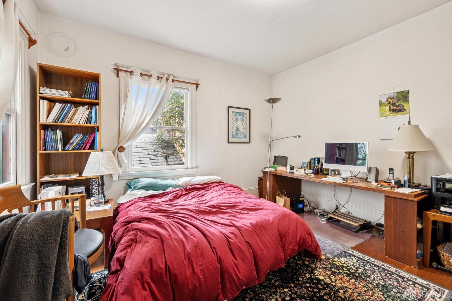 2732 Parker Street Berkeley, CA 94704 - Photo 14 of 25 a bedroom with a bed and a desk
