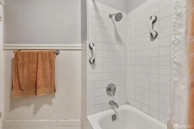 a bathroom with a sink and shower