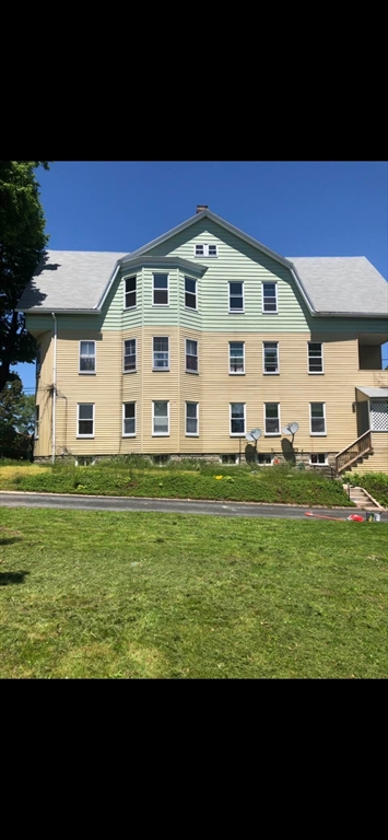58 Tower Street, Unit 3 Worcester, MA 01606 - Photo 2 of 11 a view of a big building with a big yard