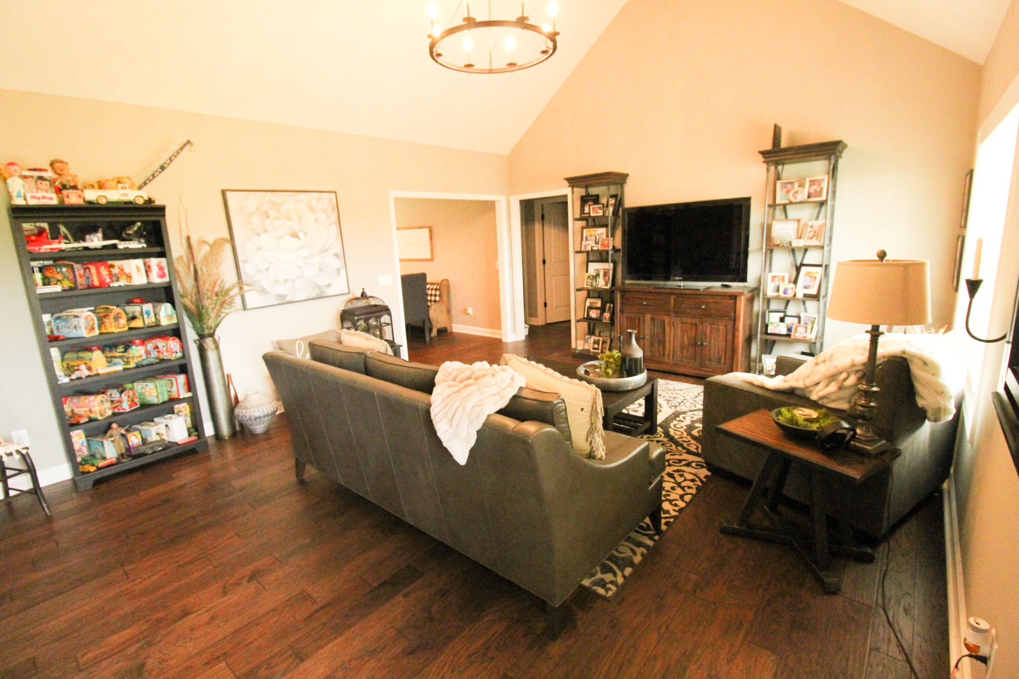 128 East Carter Road Portland, TN 37148 - Photo 13 of 26 a living room with furniture a flat screen tv and a floor to ceiling window